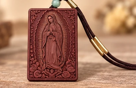 Our Lady of Guadalupe · Plaque — A full-length Marian image surrounded by radiating lines.